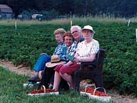Seniors wait for a ride after picking strawberries